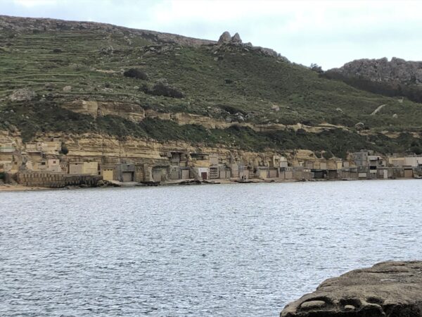 Beach “houses/rock-hewn rooms”